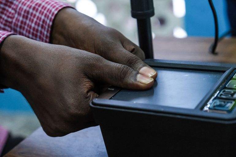 A Somali man provides his fingerprints during a biometric voter registration exercise in Mogadishu on April 15, 2025. Somalia on April 15, 2025 launched voter registration in the capital Mogadishu for the first time in over 50 years, a step towards universal suffrage ahead of presidential elections scheduled for 2026 in the volatile East African nation. (Photo by Hassan Ali Elmi / AFP)