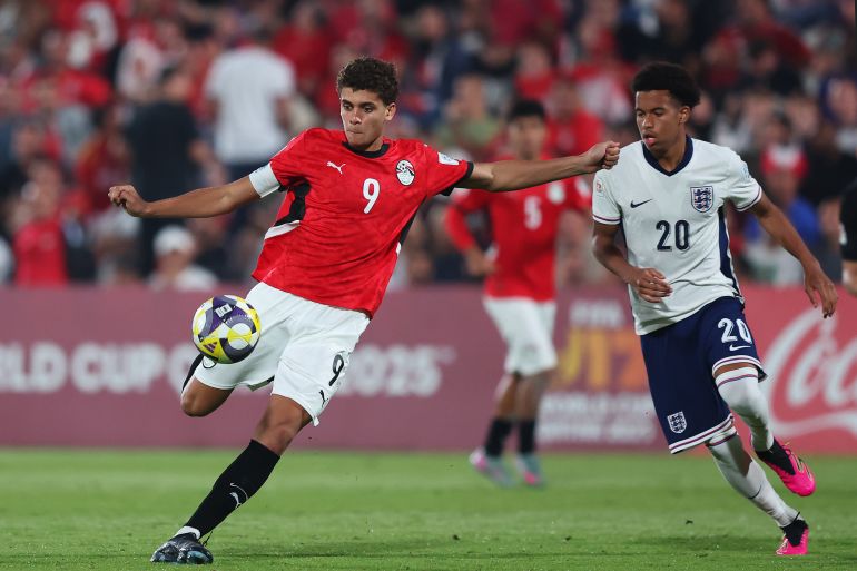DOHA, QATAR - NOVEMBER 10: Hamza Abdelkarim of Egypt shoots whilst under pressure from Louis Page of England during the first stage Group E match between Egypt and England at Aspire Zone Pitch 7 on November 10, 2025 in Doha, Qatar. (Photo by Mohamed Farag - FIFA/FIFA via Getty Images)