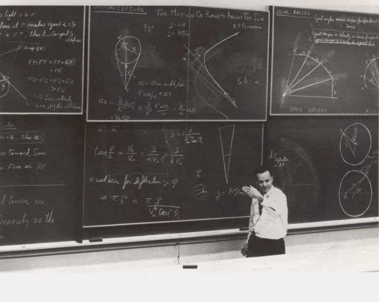 Dr. Richard Feynman during a lecture on the motion of planets around the sun.