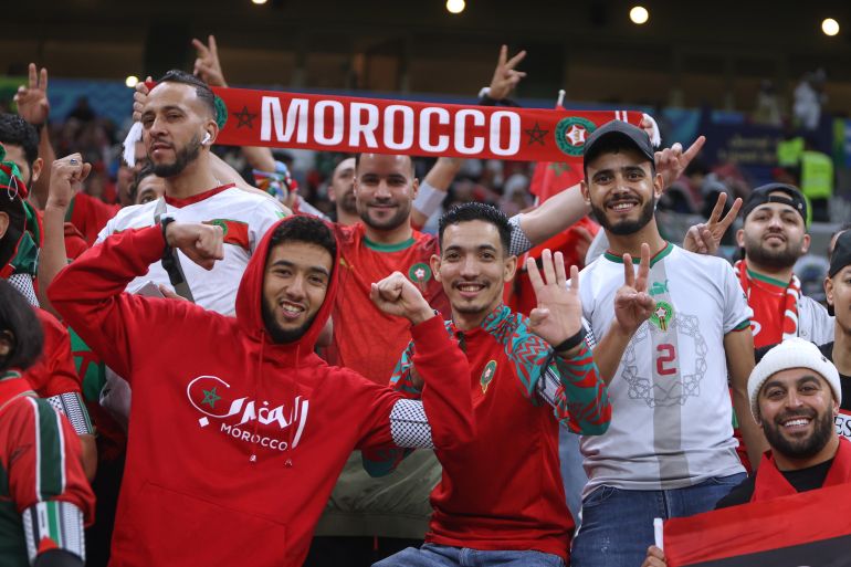 Moroccan supporters cheer at the stand prior to the FIFA Arab Cup final soccer match between Jordan and Morocco in Lusail, Qatar, Thursday, Dec. 18, 2025.