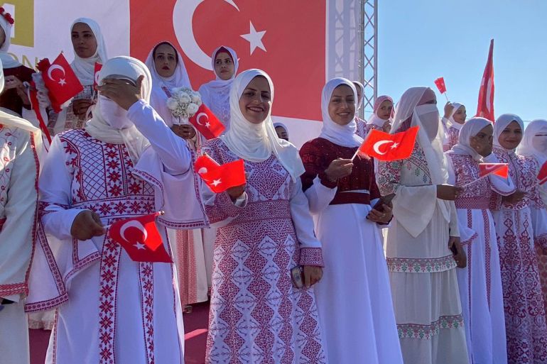 Brides at the mass wedding ceremony wore dresses with traditional Palestinian embroidery