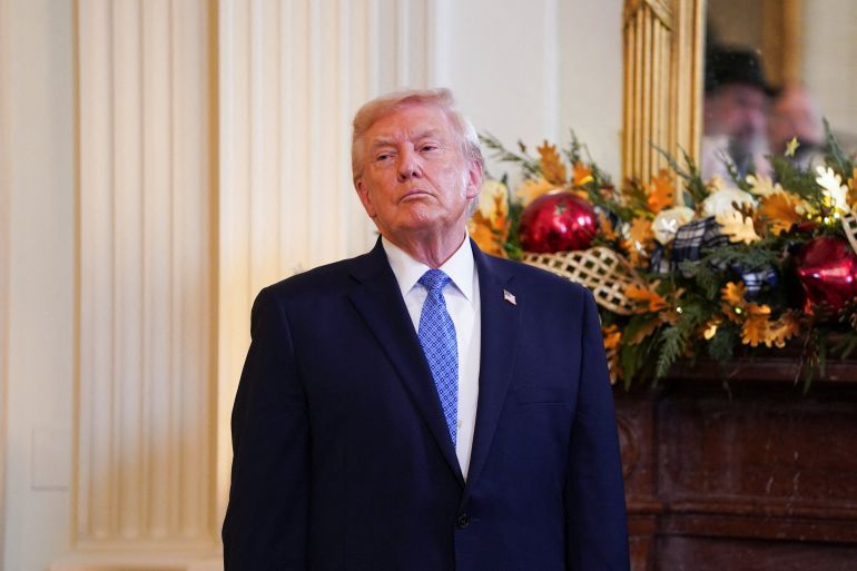 U.S. President Donald Trump looks on during a Hanukkah reception in the East Room of the White House in Washington, D.C., U.S., December 16, 2025.