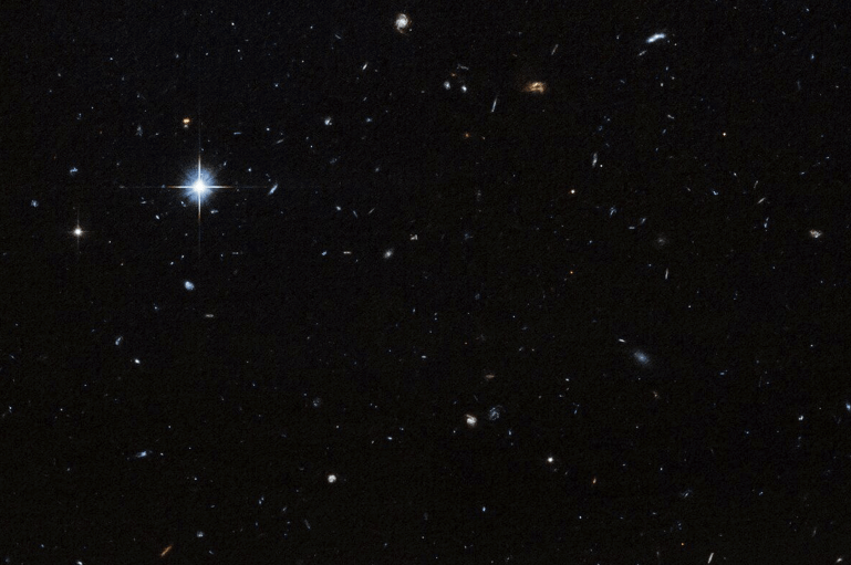 One of the images captured by the Hubble Telescope of a dark field where the 'Cloud-9' cloud is located.