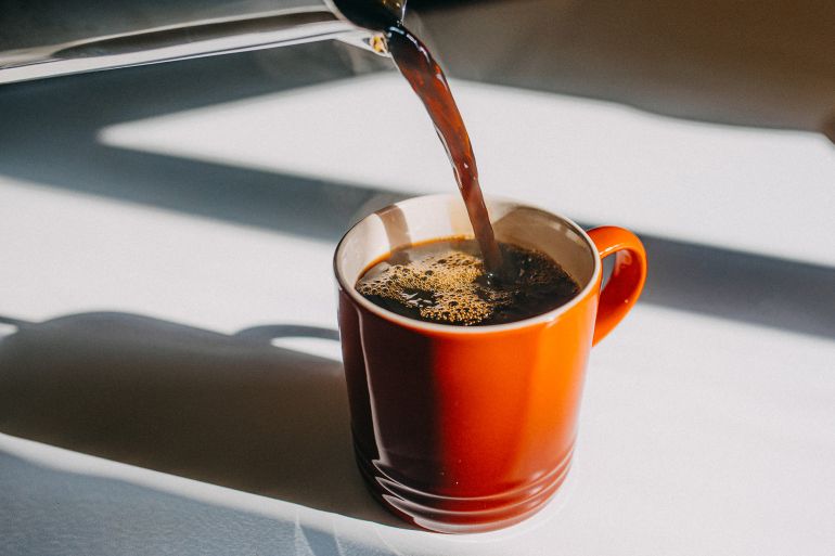 Coffee Pouring In Mug - stock photo