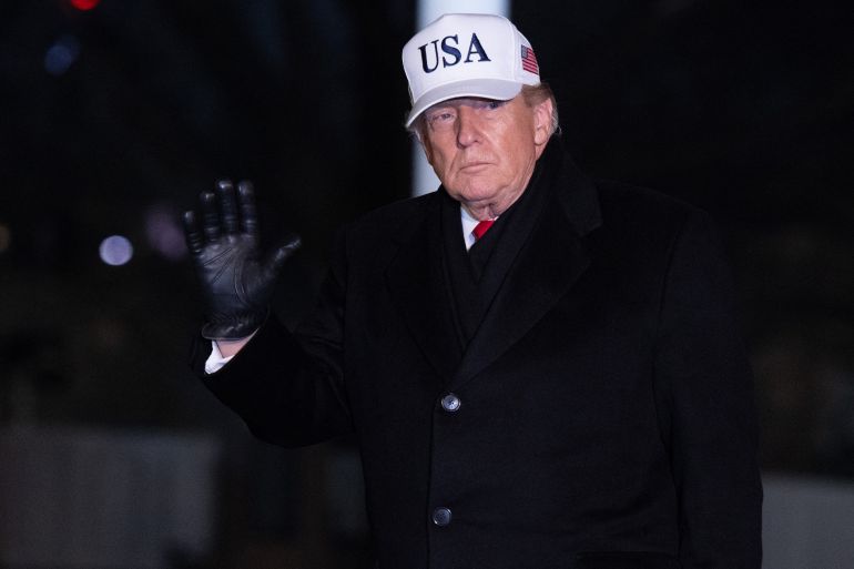 US President Donald Trump waves as he walks across the South Lawn after arriving on Marine One at the White House in Washington, DC, January 27, 2026, following a trip to Iowa.