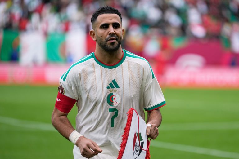 Algeria's Riyad Mahrez walks on the pitch before before the Africa Cup of Nations group E soccer match between Algeria and Sudan in Rabat, Morocco, Wednesday, Dec. 24, 2025. (AP Photo/Mosa'ab Elshamy)