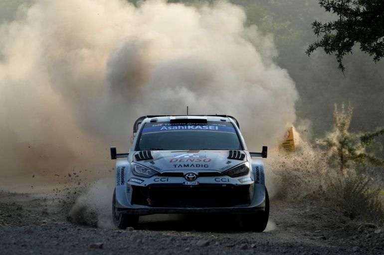 Finland's driver Kalle Rovanpera and his co-driver Jonne Halttunen with Toyota GR Yaris Rally 1 compete during a special stage of WRC Acropolis Rally in Elateia, some 167 kilometers (104 miles) north of Athens, Greece, Friday, June 27, 2025 (AP Photo/Thanassis Stavrakis)