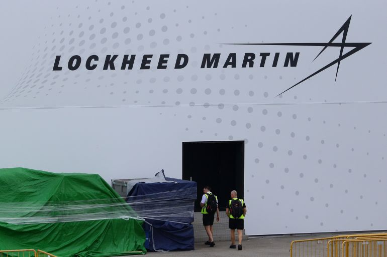 SINGAPORE - FEBRUARY 09: A man looks at the container goods sitting outside the Lockheed Martin booth during the Singapore Airshow media preview on February 9, 2020 in Singapore. Lockheed Martin, the USA weapons maker, will not be participating in next week's Singapore Airshow over the coronavirus concerns.