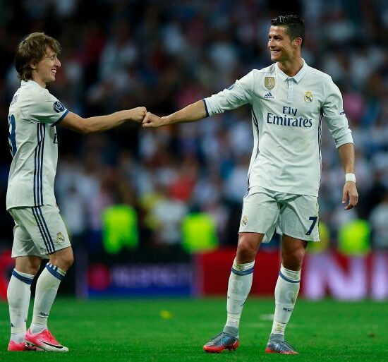 MADRID, SPAIN - APRIL 18: Cristiano Ronaldo (R) of Real Madrid CF clashes knuckles with his teammate Luka Modric (L) after the UEFA Champions League Quarter Final second leg match between Real Madrid CF and FC Bayern Muenchen at Estadio Santiago Bernabeu on April 18, 2017 in Madrid, Spain. (Photo by Gonzalo Arroyo Moreno/Getty Images)