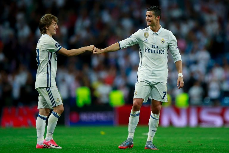 MADRID, SPAIN - APRIL 18: Cristiano Ronaldo (R) of Real Madrid CF clashes knuckles with his teammate Luka Modric (L) after the UEFA Champions League Quarter Final second leg match between Real Madrid CF and FC Bayern Muenchen at Estadio Santiago Bernabeu on April 18, 2017 in Madrid, Spain. (Photo by Gonzalo Arroyo Moreno/Getty Images)
