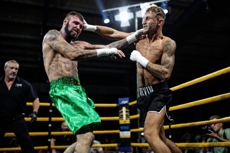 MANCHESTER, ENGLAND - AUGUST 04: Jay 'BamBam' Eggleston, 35 from Sheffield (L) fights Luke Nevin, 22 from Newcastle (R) during an Ultimate Bare Knuckle Boxing (UBKB) event at Bowlers Exhibition Centre on August 4, 2018 in Manchester, England. The first formal bare-knuckle boxing bout in Britain was recorded in 1681 with the sport popularised by the end of the 17th century. The introduction of gloves into boxing with the Queensberry rules in 1867 eventually pushed bare-knuckle underground. Today the sport remains legal, but with no licensing body in place bare-knuckle in the UK is unregulated. Consisting of three 2-minute rounds or five 2-minute rounds for title fights, though rarely lasting that long, a fight sees boxers punch one another until knockout or until the referee or medic is forced to end it. Bare-knuckle boxing now looks set to shed its underground image and become more mainstream as the sports moves from pubs and car parks to bigger, more established venues. (Photo by Jack Taylor/Getty Images)