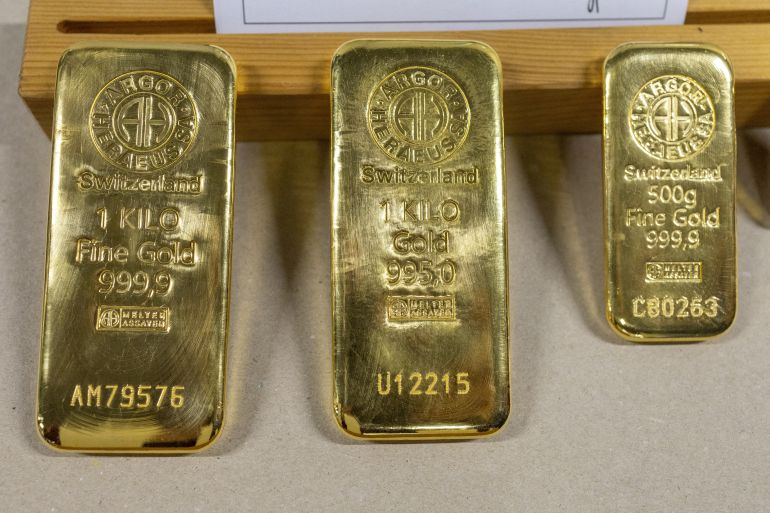 FILE PHOTO: Gold bars are pictured in a display area at the plant of refiner and bar manufacturer Argor-Heraeus in Mendrisio, Switzerland, July 13, 2022.