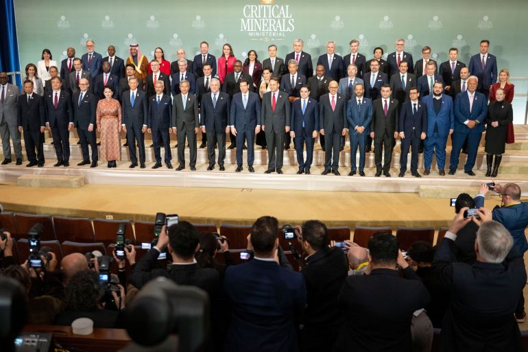 Photographers capture the group of ministers as they gather for a photo during the Critical Minerals Ministerial meeting at the State Department, Wednesday, Feb. 4, 2026 in Washington. (AP Photo/Kevin Wolf)
