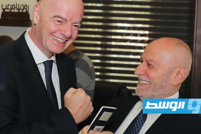 FIFA President Gianni Infantino holds his passport after officially obtaining Lebanese citizenship.