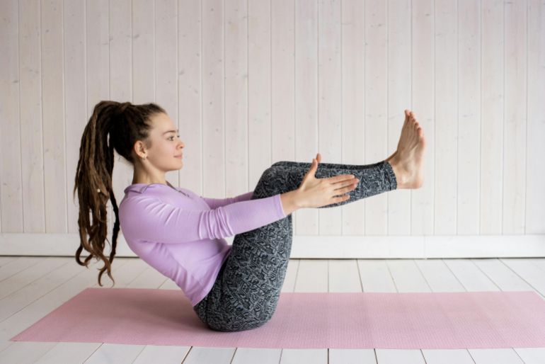 Photo Of Woman Sitting On Yoga Mat