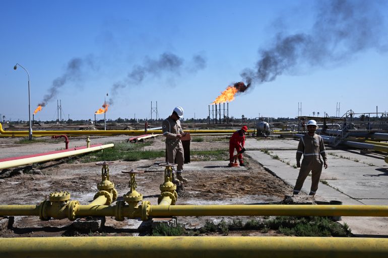 TOPSHOT - Employees of Basra Oil Company, work at the Nahr Bin Umar Oil and Gas Field on the outskirts of the southern Iraqi city of Basra on April 29, 2026.